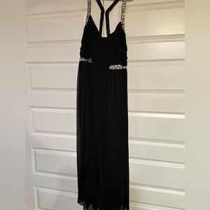 Truly gorgeous black formal dress. Rhinestone embellishment on straps and waist.